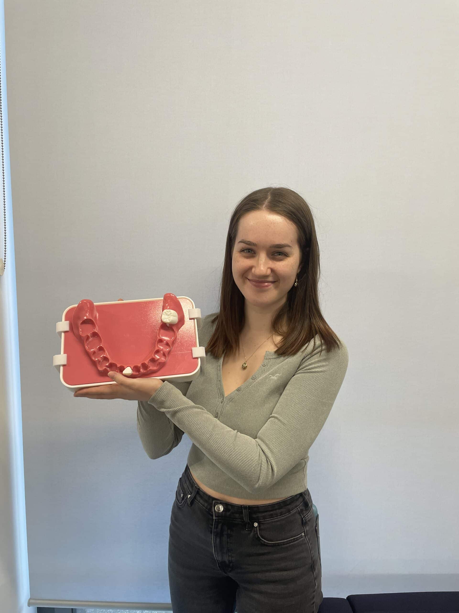 Engineering student showing dental 3D image